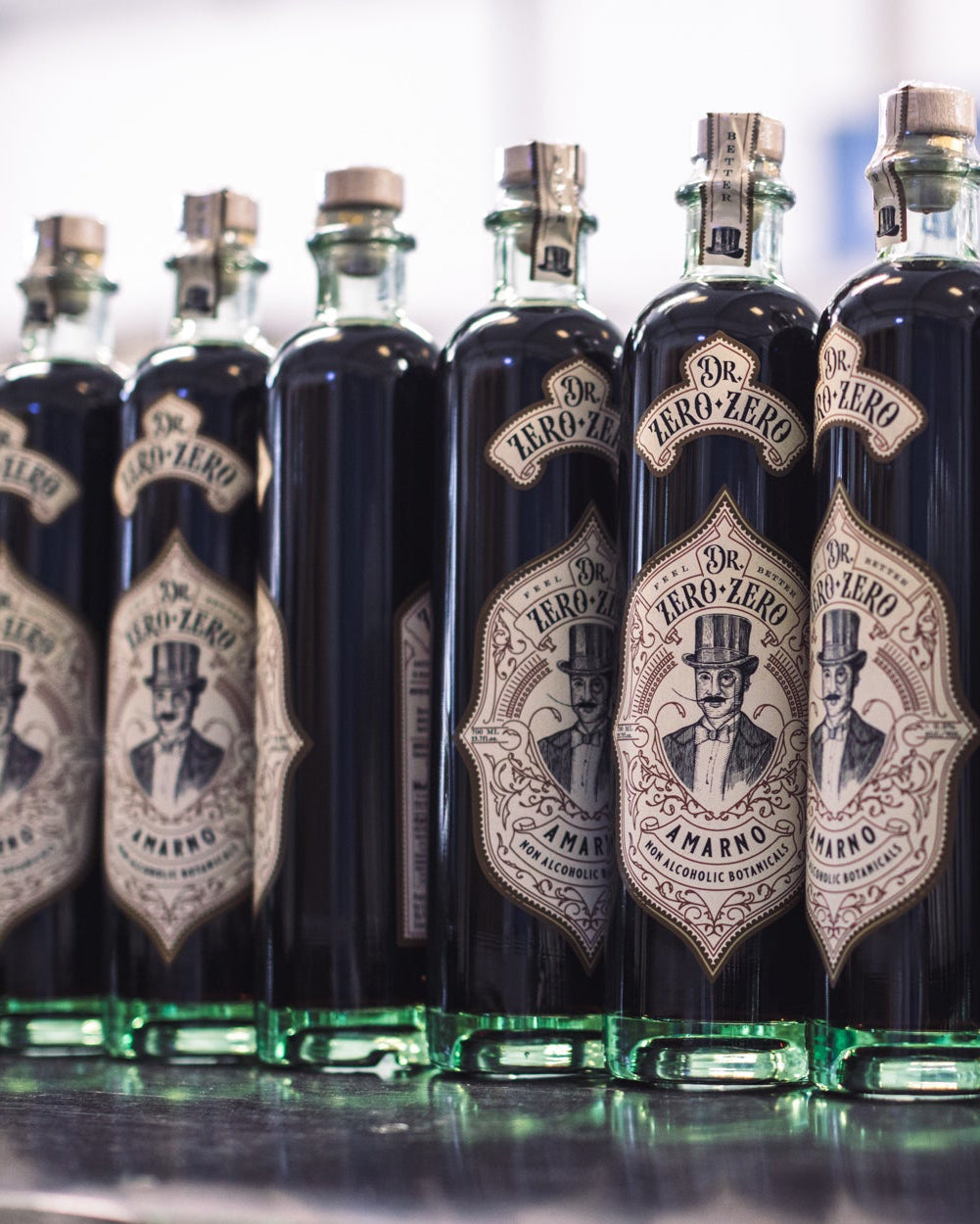 Multiple bottles of AmarNo lined up in a row, with labels visible.